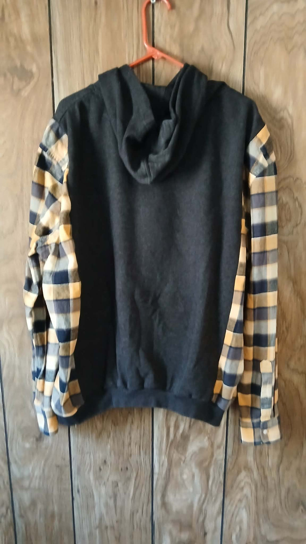 Dark gray hoodie with flannel sleeves