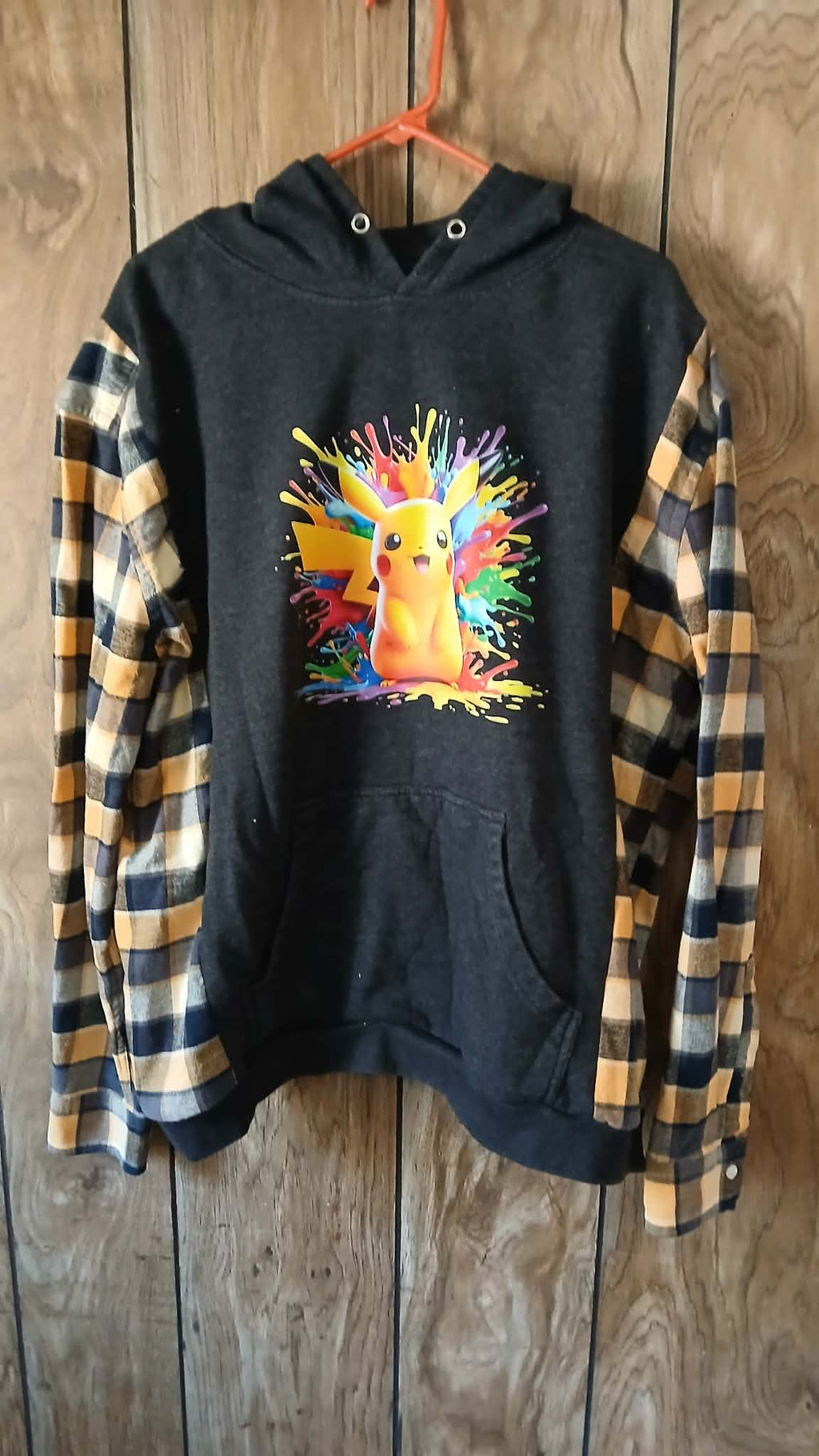 Dark gray hoodie with flannel sleeves
