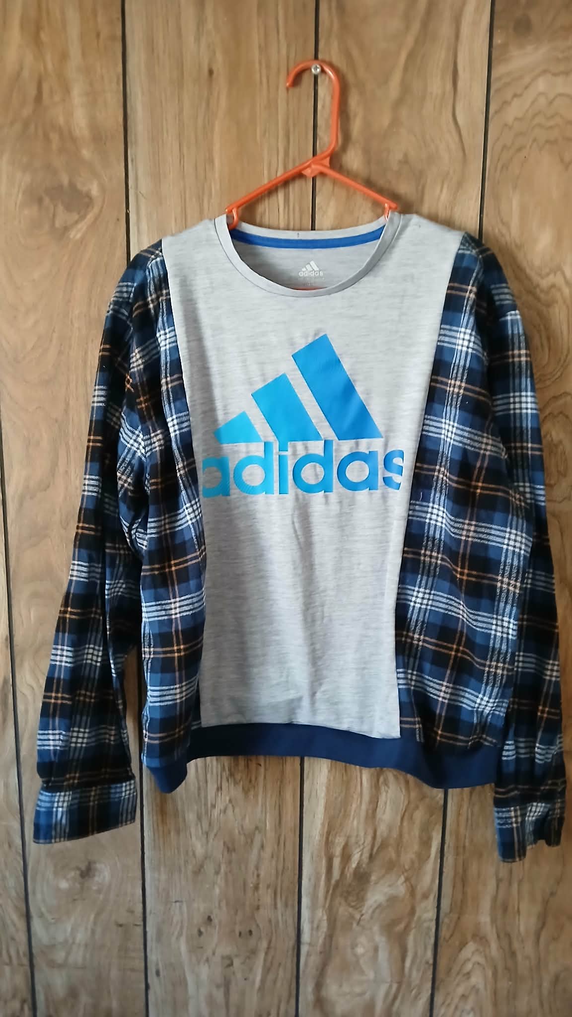 reworked adidas shirt with flannel sleeves